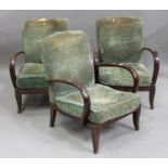A set of three mid-20th century stained beech open armchairs, upholstered in green fabric, raised on