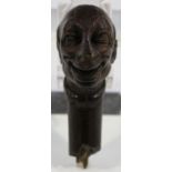 A 19th century carved wooden novelty walking cane handle, modelled as the head of a large-nosed