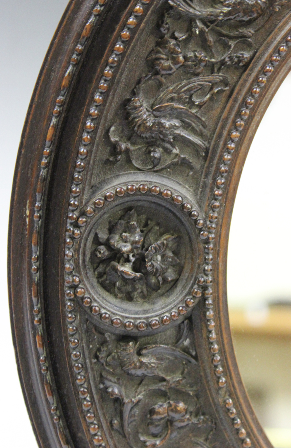 A 19th century Italian Baroque Revival carved wooden oval wall mirror, the wide frame finely - Image 2 of 3