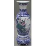 A late 20th century Chinese blue and white porcelain floor vase and stand, total height 99cm.Buyer’s