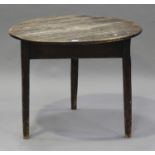 A 19th century pine circular cricket table, raised on three block legs, height 71cm, diameter