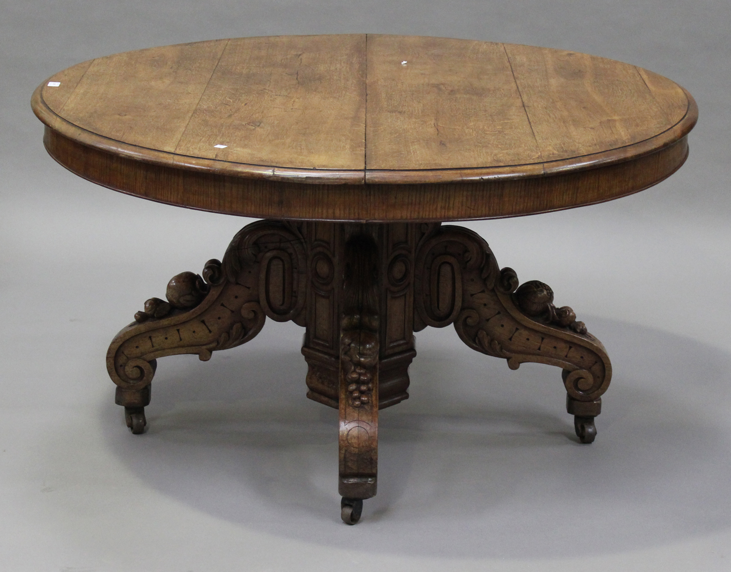 A late 19th century Continental oak circular centre table, the moulded top raised on an octagonal