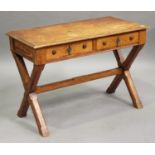 An Arts and Crafts pine side table, fitted with two frieze drawers, raised on 'X' frame supports,