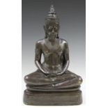 A mid-20th century South-east Asian brown patinated cast bronze figure of a seated Buddha, height