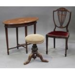 An Edwardian mahogany oval occasional table, the crossbanded top with inlaid oval fan patera, height