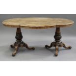 An early Victorian rosewood centre table, the shaped top raised on two turned and carved baluster