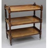 A mid Victorian mahogany three-tier buffet with reeded baluster supports and three-quarter