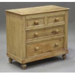 A Victorian stripped pine chest of two short and two graduated long drawers, on bun feet, height