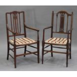 An Edwardian inlaid mahogany elbow chair with a pierced splat back and shaped arms, width 52cm,