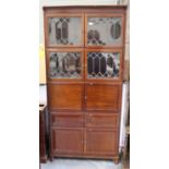An early 20th century mahogany five-section bookcase cabinet, fitted with leaded glass and