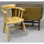 A George V oak rectangular gateleg dining table with piecrust border, raised on barley twist legs,