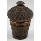 A 19th century carved coquilla nutmeg grater, the hobnail cut lid revealing an ivory framed metal