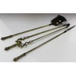 A set of three 20th century brass fire tools, comprising tongs, shovel and poker.Buyer’s Premium