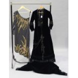A late Victorian midnight blue velvet lady's dress with applied lace collar and cuffs, the long