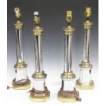 A set of four late 20th century chromium plated and brass table lamps of column form, height 55cm.