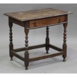 An 18th century and later oak lowboy, fitted with a single frieze drawer, raised on bobbin turned