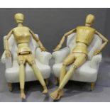 A pair of modern carved beech life-size fully articulated artist's mannequins, one male, the other