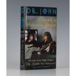 MUSIC. - Mac REBENNACK, 'Dr. JOHN'. Under a Hoodoo Moon… the Life of Dr. John, the Night Tripper.