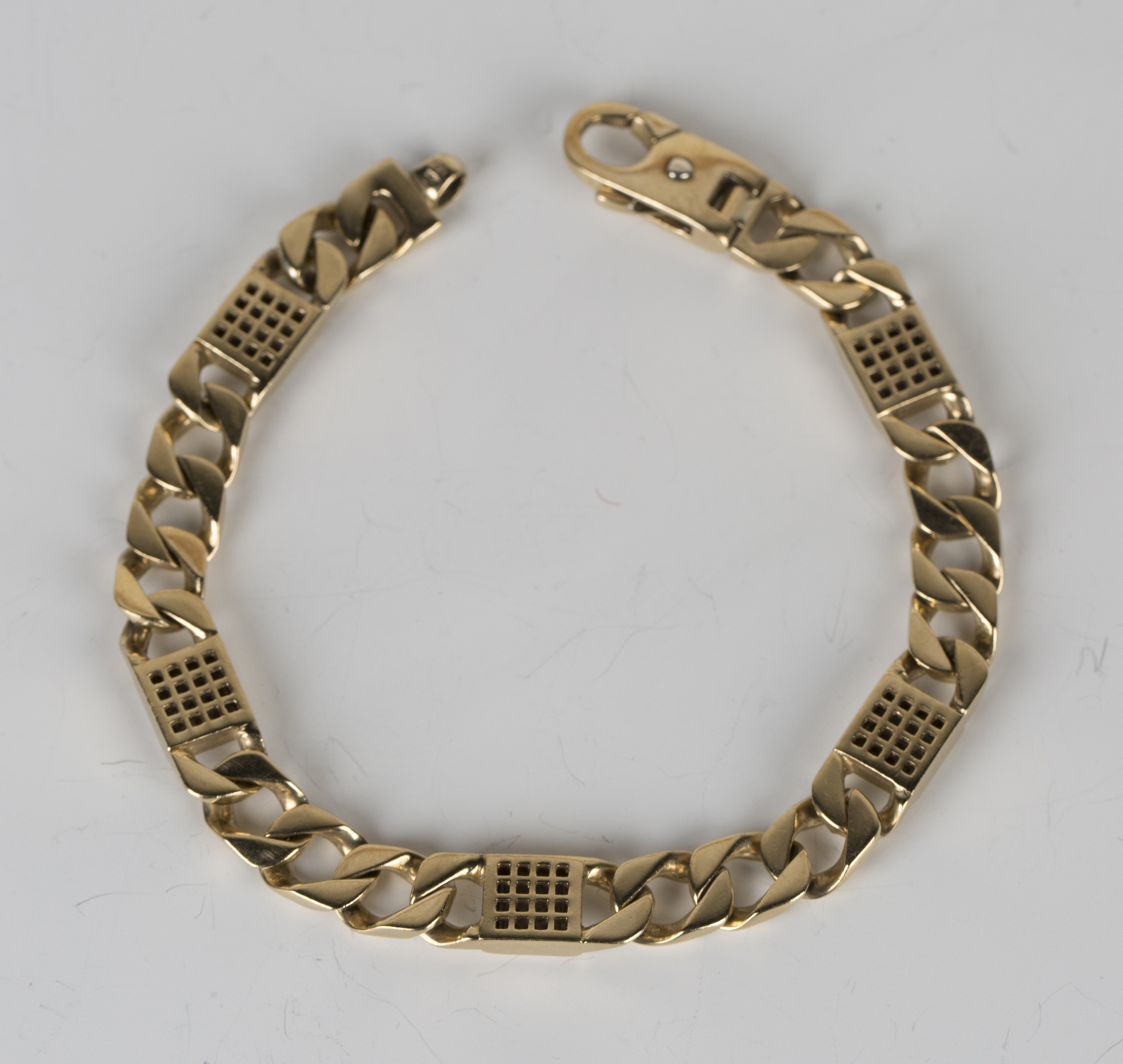 A 9ct gold and diamond bracelet in a faceted curblink design, spaced with five diamond set nine - Image 2 of 2