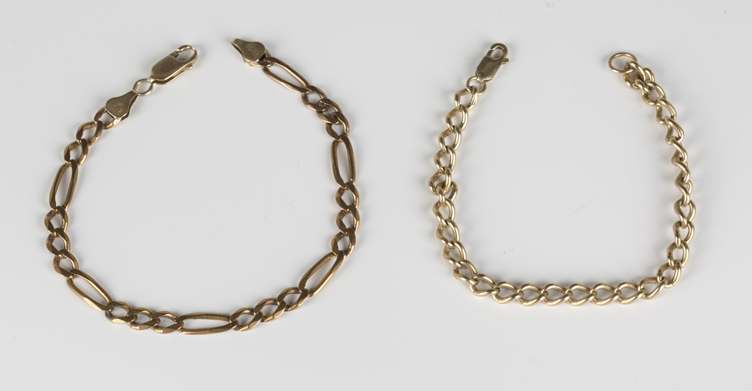 A 9ct gold Figaro link bracelet on a sprung hook shaped clasp, length 21.5cm, and a gold curblink