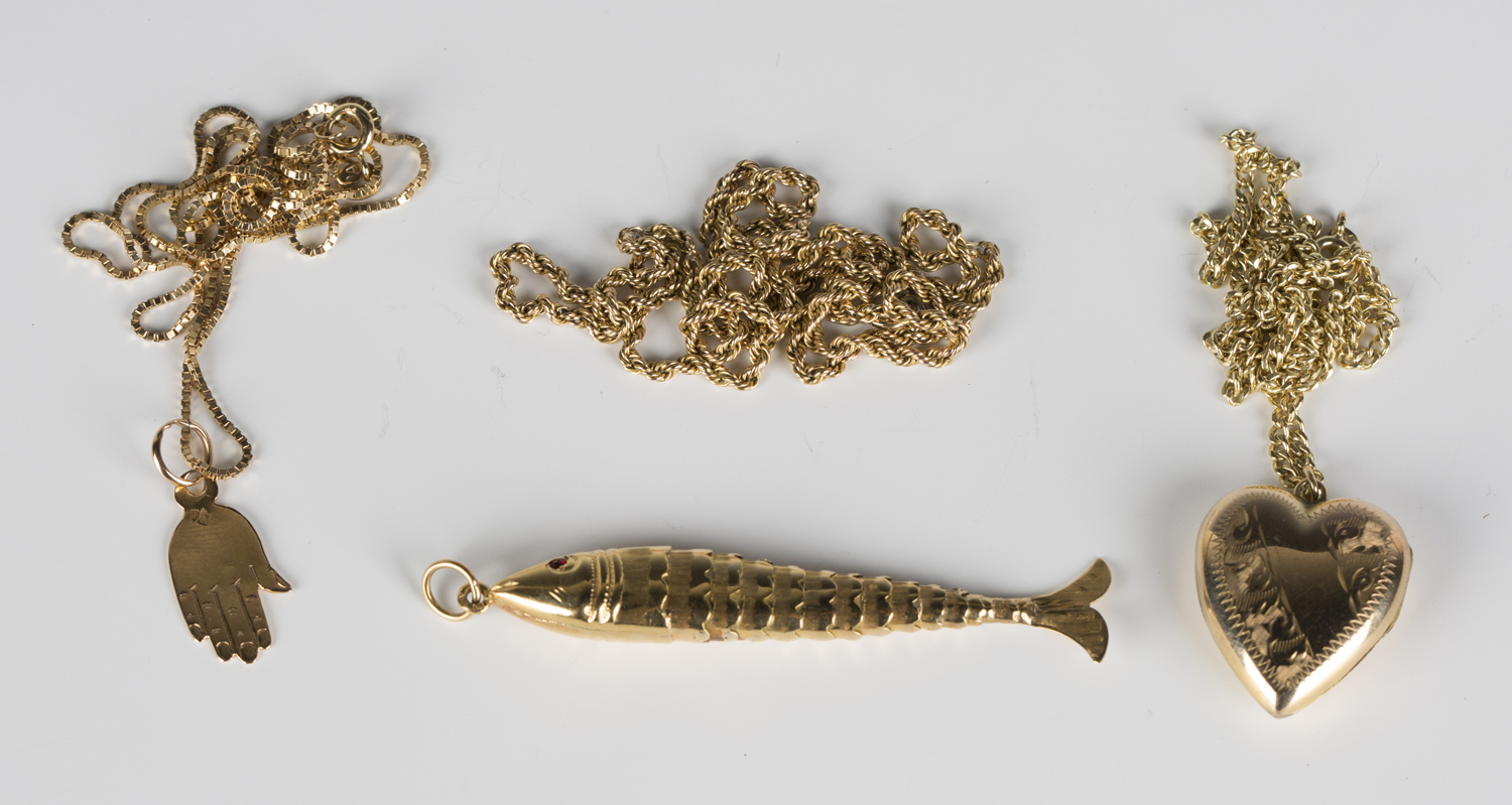 A gold pendant, designed as an articulated fish, length 7cm, with a gold ropetwist link neckchain (