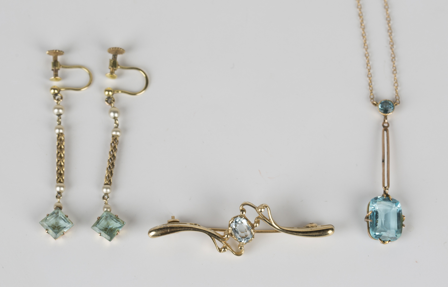 A gold and pale blue gem set pendant necklace, a pair of gold topped imitation pearl and pale blue