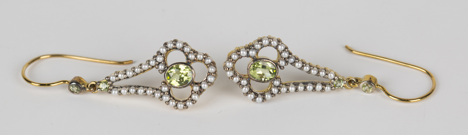 A pair of peridot and seed pearl pendant earrings, length 3.8cm, cased.Buyer’s Premium 29.4% (