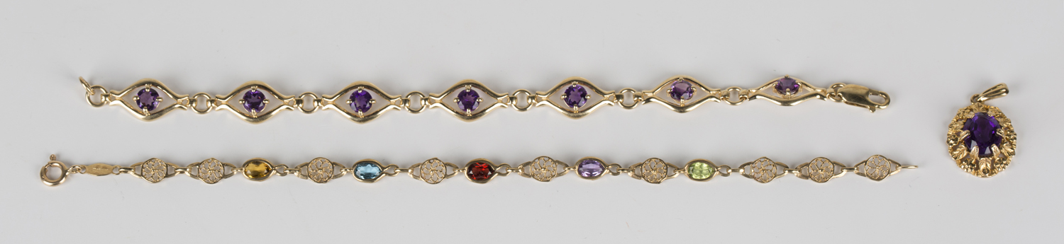 A 9ct gold and amethyst single stone pendant, length 2.5cm, a 9ct gold bracelet, mounted with a