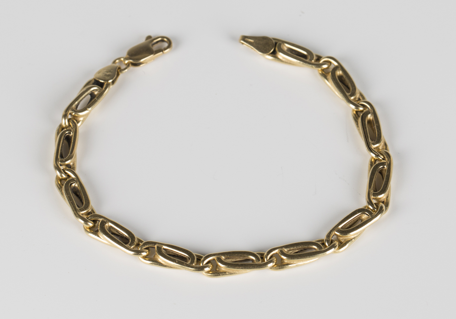 An 18ct gold multiple link bracelet on a sprung hook shaped clasp, detailed '750', length 18cm.