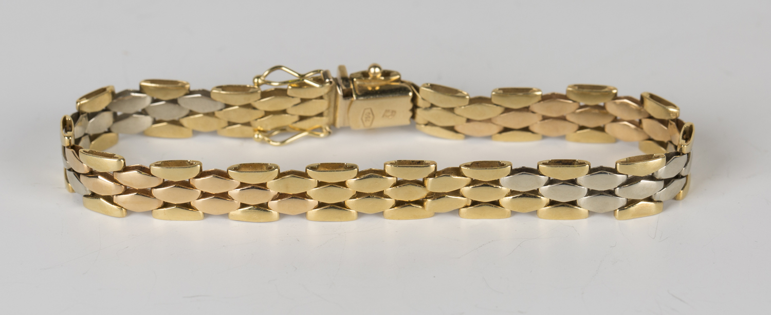 A three colour gold bracelet on a snap clasp with fold-over safety catches, detailed '750', length