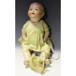 An Armand Marseille bisque head baby doll, impressed '351/4.K', with painted moulded hair,