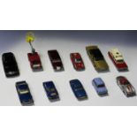 A collection of die-cast vehicles, including a Dinky Toys No. 23H Ferrari, a No. 23J H.W.M., a No.