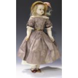 A mid-19th century Augusta Montanari poured wax head and shoulders doll with inserted blonde hair,