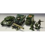 A collection of die-cast military vehicles and accessories, including a Britains 155mm gun, a