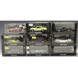 Nine Minichamps 1:43 scale model cars, including a Jaguar XJ-S TWR Racing, a Jaguar XJ-S