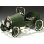 A late 20th century Baghera child's pedal car, finished in green with chromium plated mounts, on