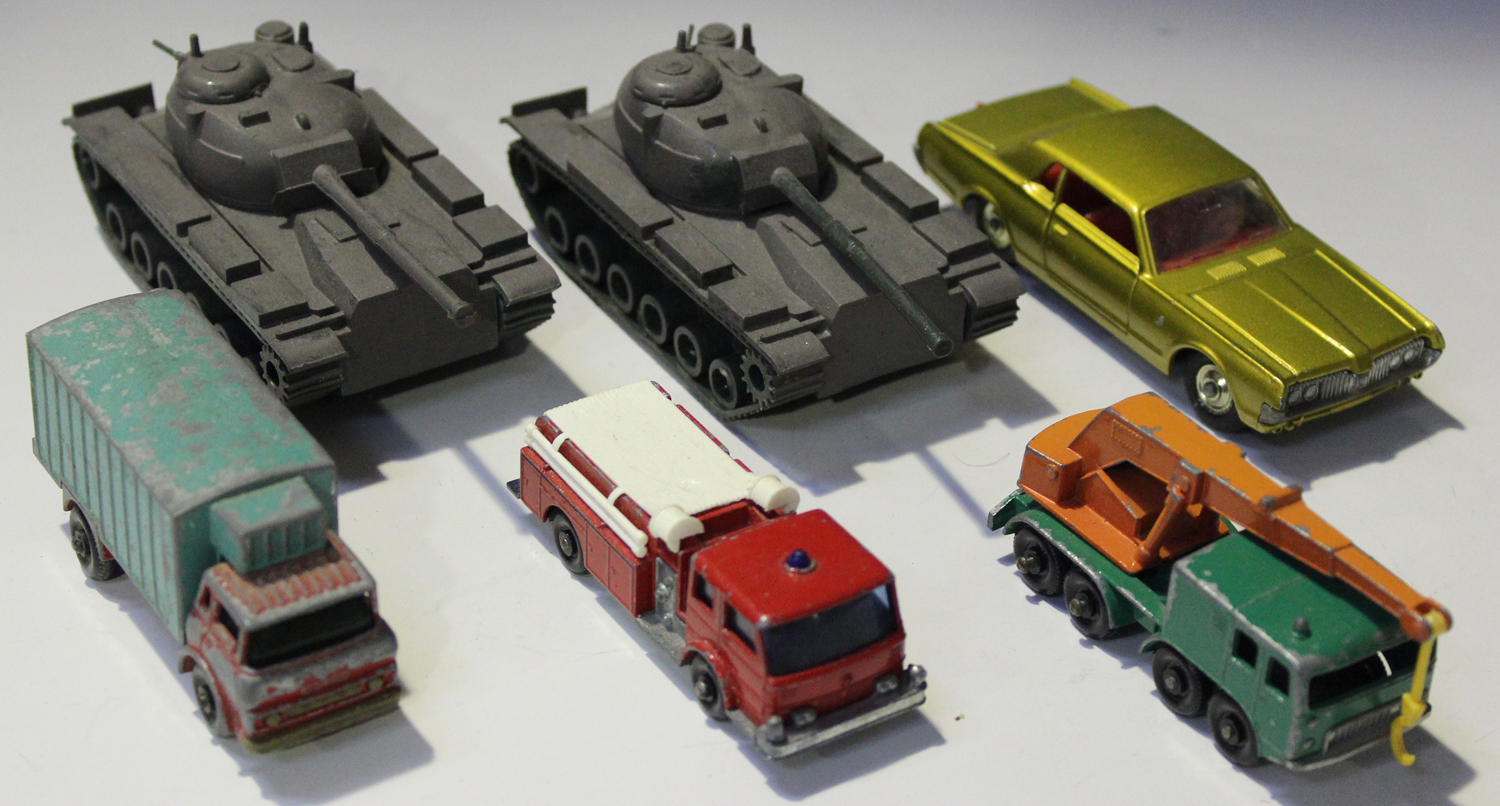 A collection of Matchbox 1-75 and Models of Yesteryear cars and commercial vehicles, together with a