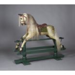 An early/mid-20th century dapple grey rocking horse with amber and black eyes, mane, tail and