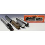 A collection of Rivarossi gauge HO railway items, including a No. 1120 steam locomotive and