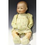 An Armand Marseille bisque head baby doll, impressed 'AM 351/10K', with painted moulded hair,