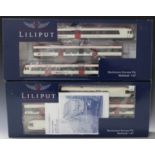 A small collection of modern Lilliput gauge HO railway items, including a No. L133940 three-car set,