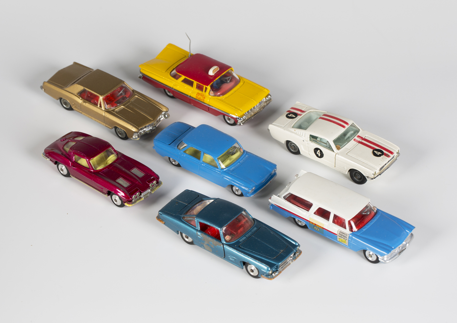 Seven Corgi Toys American cars, comprising a No. 229 Chevrolet Corvair, a No. 241 Ghia L.6.4, a