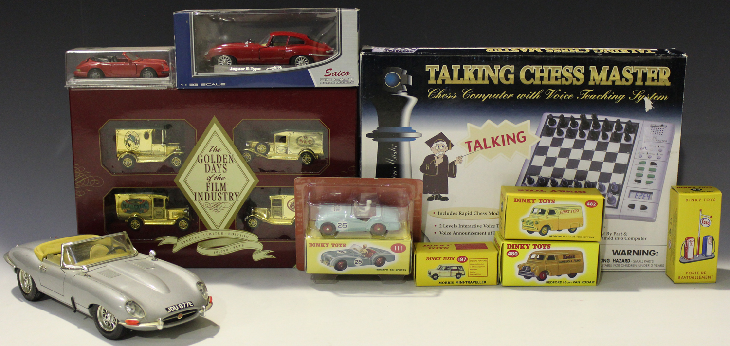 A collection of die-cast vehicles, including Atlas Dinky Toys vehicles, a Bburago E type Jaguar