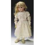 An S.F.B.J. bisque head doll, impressed 'Paris II', with later blonde wig, sleeping brown eyes,