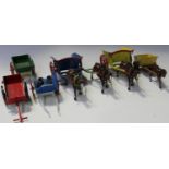 Two Britains tumbrel carts and horses, a horse and cart, three further carts and a horse with cart