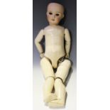 An S.F.B.J. bisque head doll, impressed '301 Paris', with pierced ears, sleeping brown eyes, open