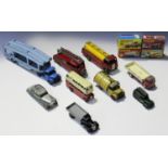 A small collection of Dinky Toys vehicles, including a No. 582 Pullmore car transporter, a No. 25a