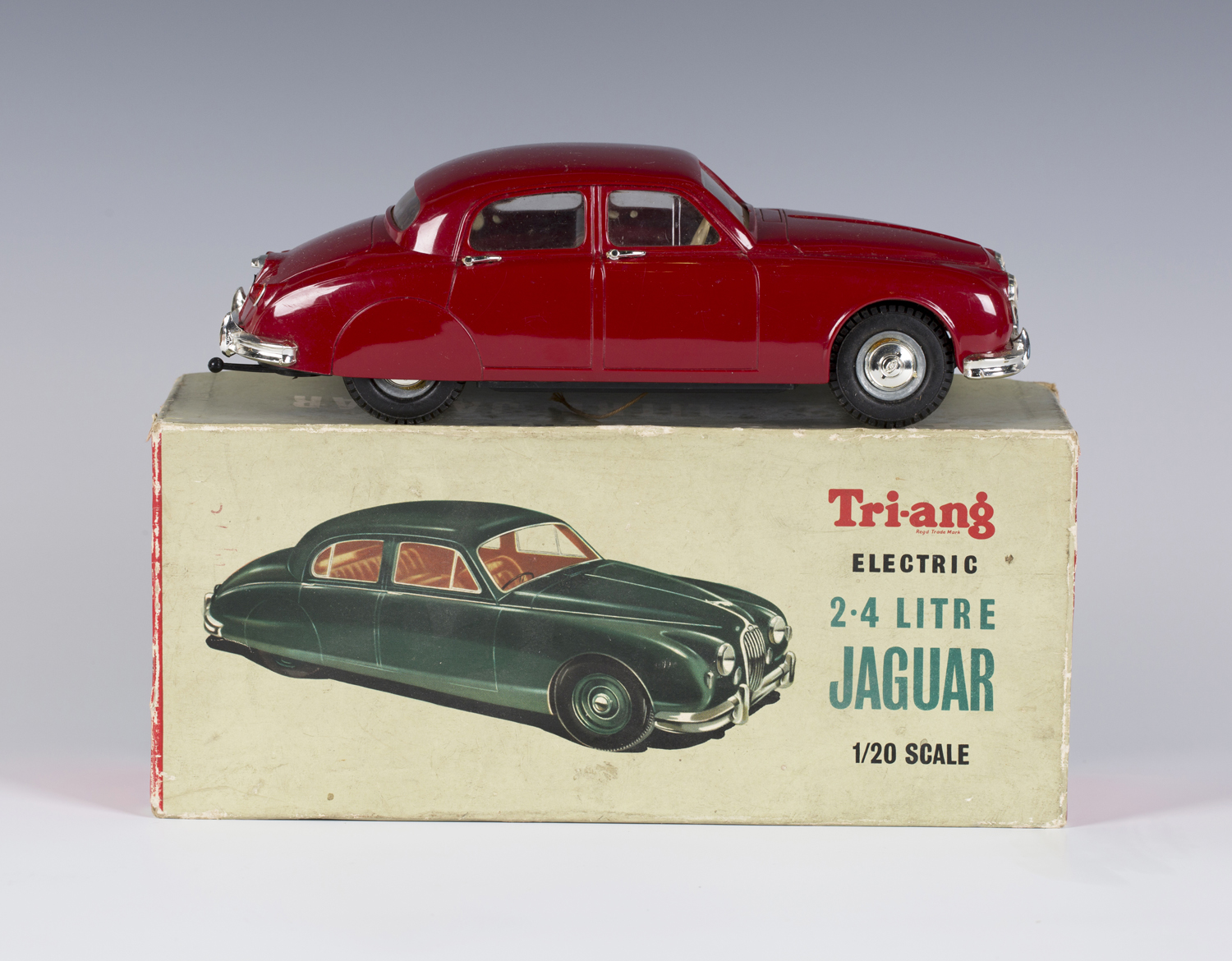 A Tri-ang electric 1:20 scale 2.4 litre Jaguar, finished in maroon with silvered fittings, boxed (