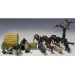 A collection of Britains lead farm figures, animals and accessories, including various horses, cows,