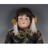 A Max Handwerck bisque head doll, impressed '2¼', with later wig, sleeping blue eyes, open mouth